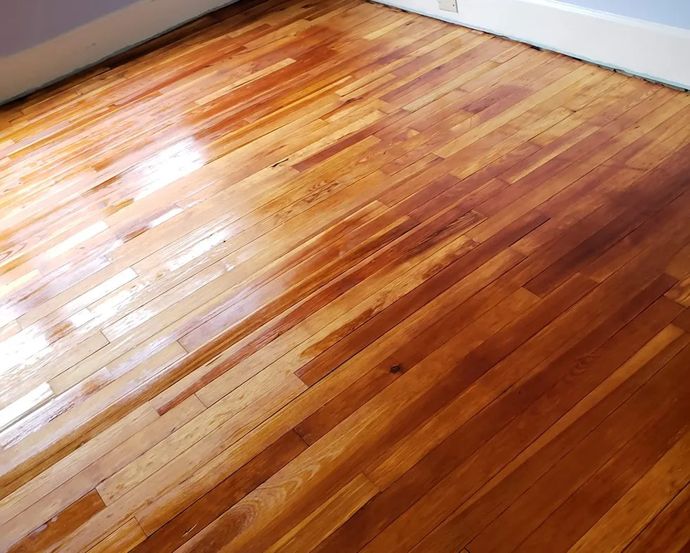 Hardwood floor refinished with a warm custom stain